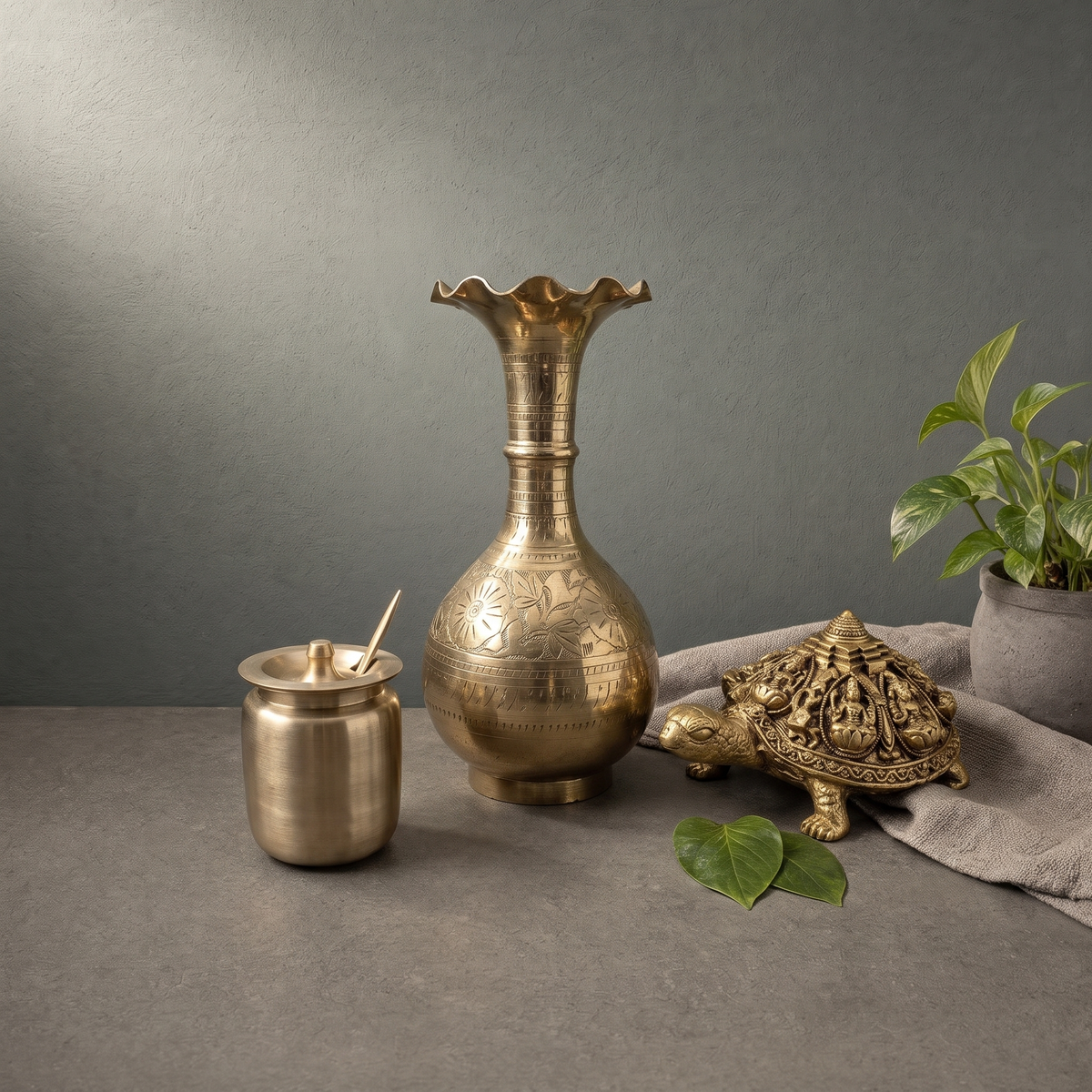 Kansa Ghee Pot with Flat Lid, Hand Engraved Brass Vase with a Petal Rim on a stone ledge - Peetal Parampara