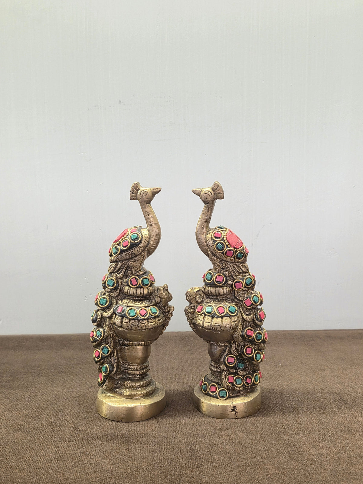 Pair of cast brass peacocks with turquoise and coral stone in bezels down the neck, wing and tail - Peetal Parampara