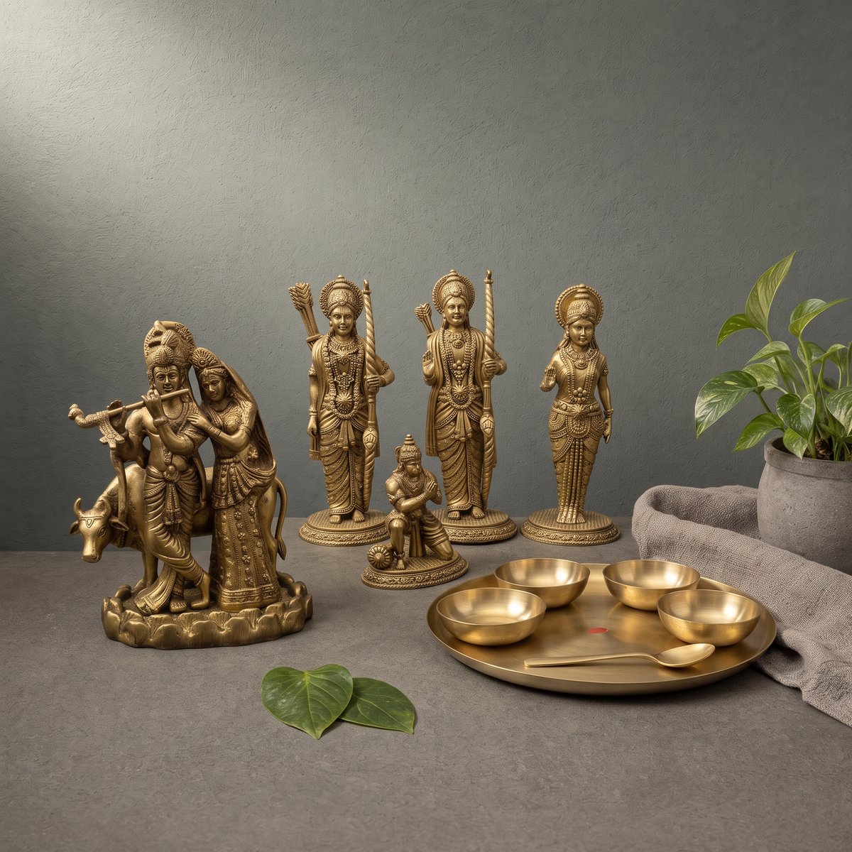 Antique Brass Radha Krishna Murti, Superfine Brass Ram Darbar Murti on a stone ledge - Peetal Parampara