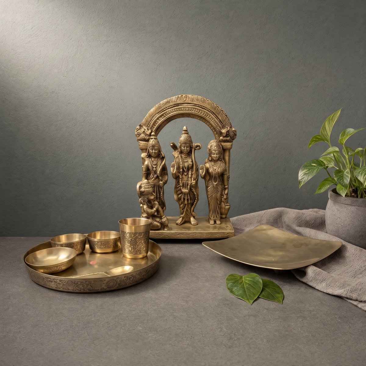 Antique Brass Ram Darbar Murti with Arch, Hand Engraved Kansa Thali Set on a stone ledge - Peetal Parampara