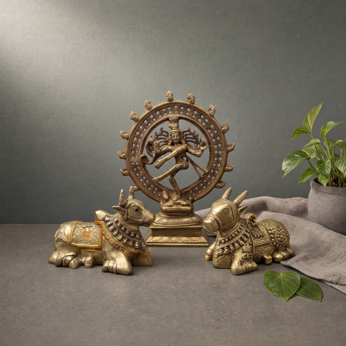 Brass Natraj Murti in a Flame Ring, Hand Painted Brass Nandi Murti on a stone ledge - Peetal Parampara