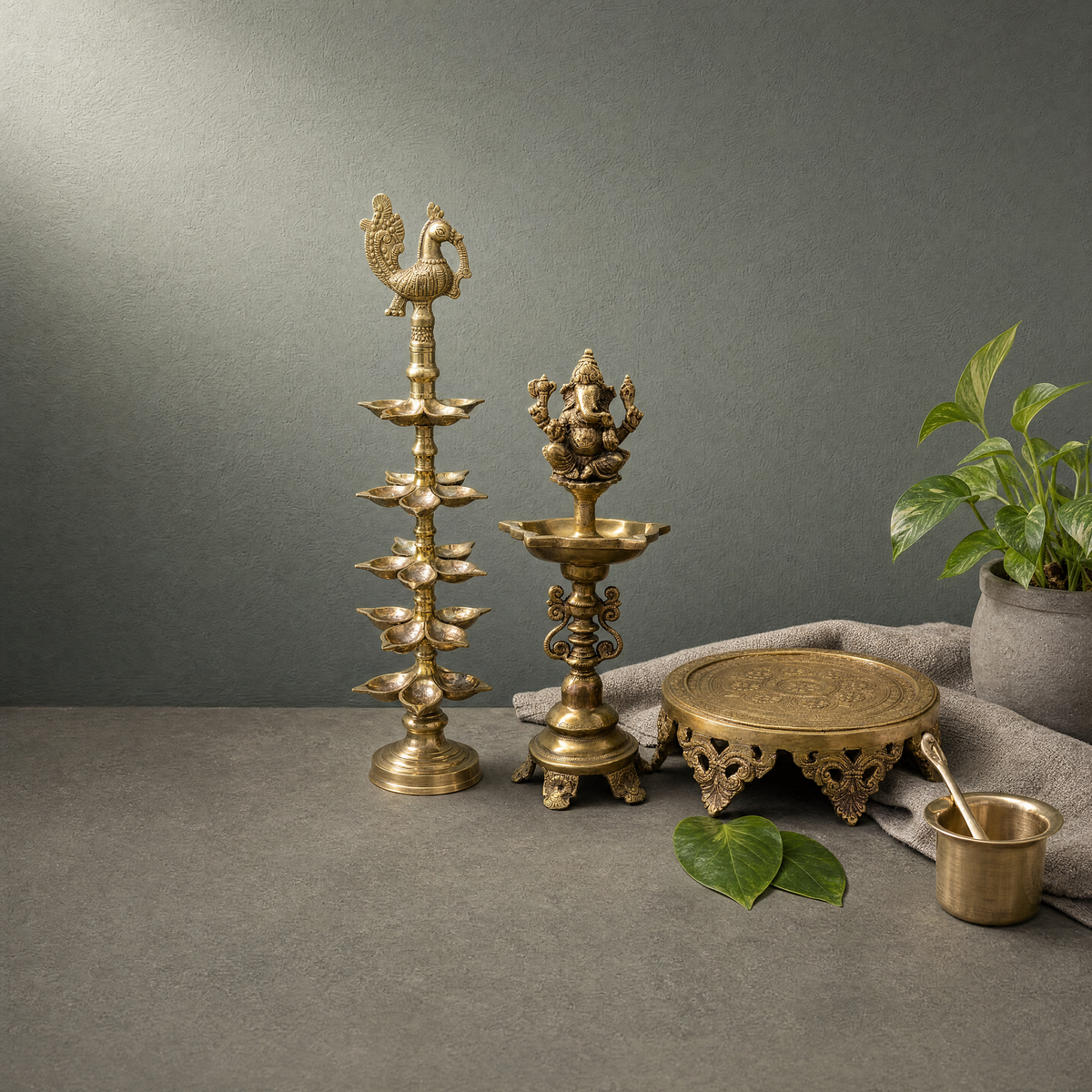 Antique Brass Ganesh Standing Diya, Hand Engraved Brass Chowki on a stone ledge - Peetal Parampara