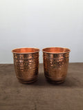Two straight-sided copper tumblers hammered between rolled beading rows, plain turned-out rims - Peetal Parampara