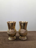 Two footed brass glasses with a raised band of figures between beaded ropes at the waist and on the foot - Peetal Parampara