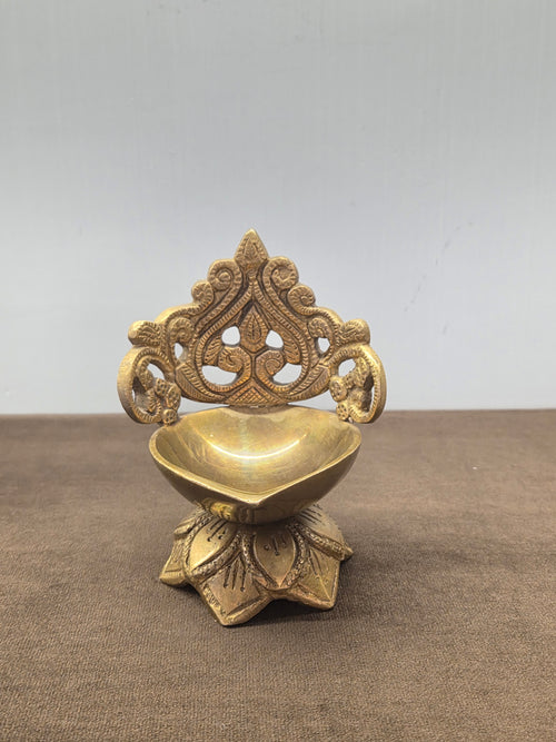 Cast brass oil lamp with a pinched bowl on a splayed lotus foot under a pierced scroll plate - Peetal Parampara