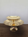 Two footed brass panvatta stacked, petal-cut edges pierced with teardrop holes over engraved floors - Peetal Parampara