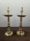 Pair of polished brass standing lamps turned in rings, with pointed bud finials over spouted oil pans - Peetal Parampara